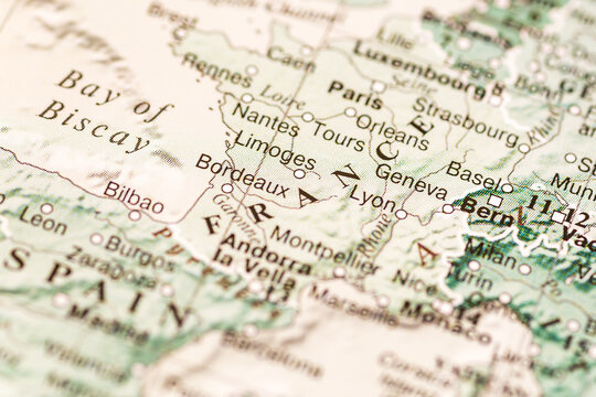 World map. France on the geographical map, world tourism, destination. Political map close-up photo.