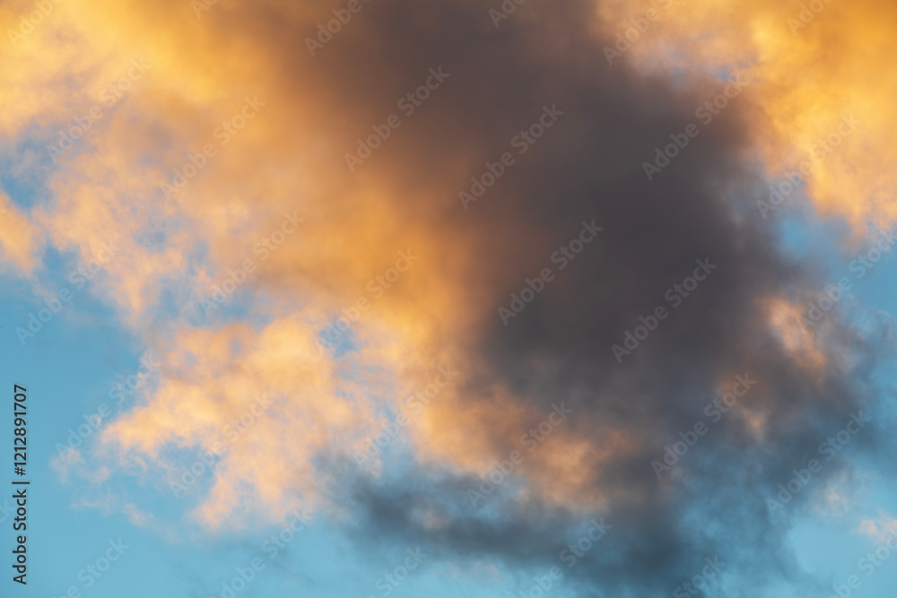 Wall mural beautiful orange sunset clouds on the blue sky. sky background.