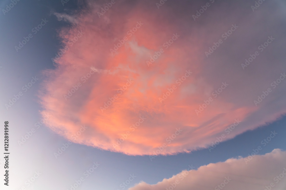 Wall mural beautiful orange sunset clouds on the blue sky. sky background.