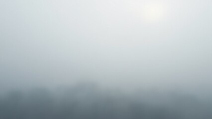 Fototapeta premium Stratus clouds form a uniform gray layer, creating a dense, fog-like atmosphere in the sky. Smooth, featureless textures evoke calm and introspection in this low-altitude scene.