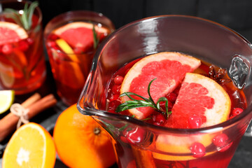 Delicious punch with rosemary in jug, closeup