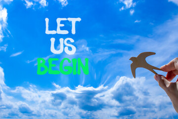 Let us begin symbol. Concept words Let us begin on beautiful blue sky. Beautiful blue sky and...