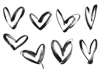 Set of realistic brush strokes and heart-shaped spots in black ink, watercolor acrylic paint on a white isolated background