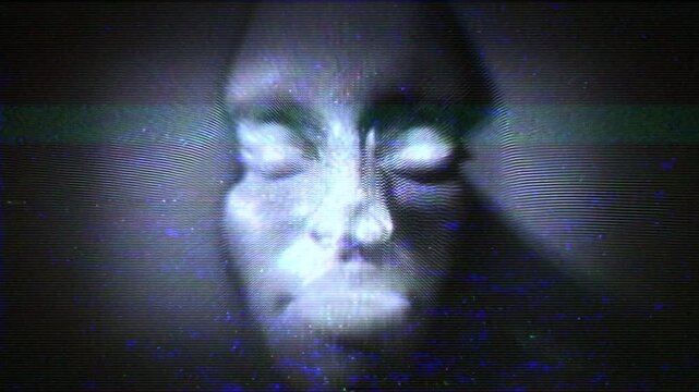 A face emerges from television white noise static with a weak TV signal and noise effects.