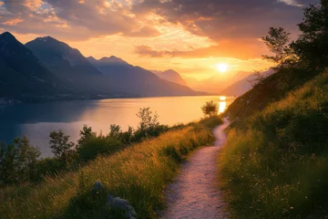 Serene Sunset Over Distant Lake and Mountain Path