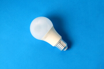 Light bulb on blue background
