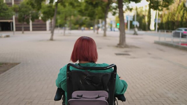 Woman navigating city streets in electric wheelchair
