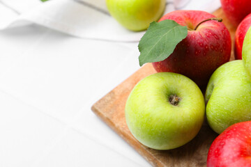 Fresh ripe apples on white table, closeup. Space for text