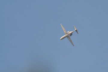 A small plane is flying in the sky