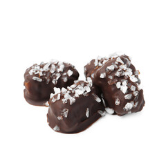 Tasty chocolate candies with salt isolated on white