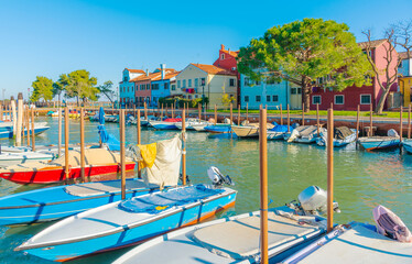 Scenic harbor with colorful boats in Burano, Venice Lagoon