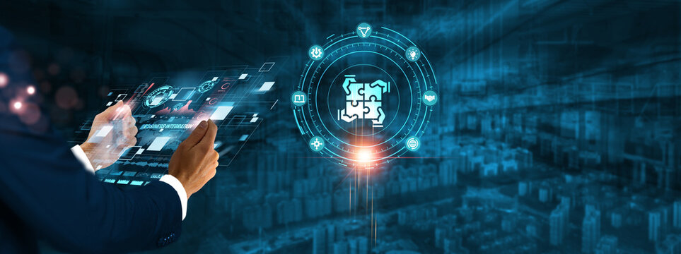Business Integration: Businessman holding virtual interface panel of digital device on global networking, automation, optimization, data sharing, and integration technology in futuristic.
