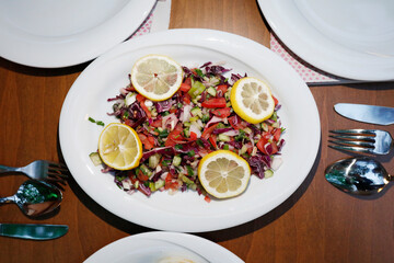 Mixed breakfast in nature salads tomatos, vegetables, lemons