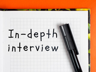 In-depth interview title inscription on notepad page colored background