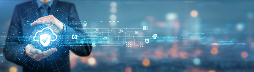 Businessman holding cloud security shield, encryption key, firewall system, data protection, cybersecurity framework, authentication protocols, virtual storage, network monitoring compliance standards