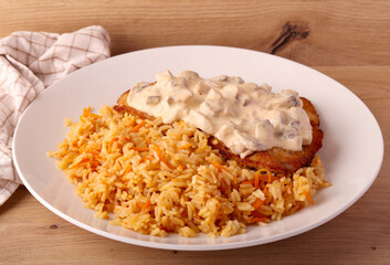 Carrot rice with fried turkey fillet