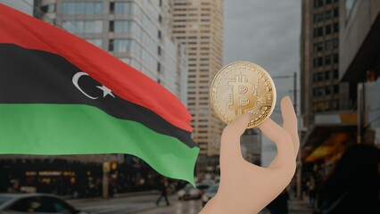 Golden bitcoin held by a hand with a waving Libya flag in the background against a modern urban...