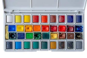 Paris, France - 01 12 2025: Top view of a Watercolor paint box with colorful watercolor buckets.