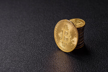 Bitcoin as a metal round coin on a dark background. Cryptocurrency