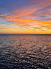 Obraz premium Dusk sky clouds over calm sea.