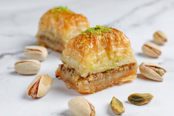 Turkish-style pistachio baklava with a glass of milk.