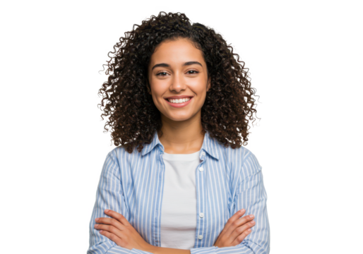 A young woman wearing a light blue striped shirt over a white T-shirt, arms crossed, smiling warmly isolated on transparent background