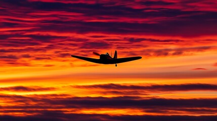 Obraz premium Majestic airplane silhouetted against a colorful sunset sky