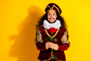 Charming Nobleman Posing in Historic Costume With Bright Yellow Background