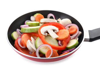 Frying pan with mix of fresh vegetables and mushrooms isolated on white