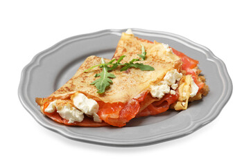 Delicious crepes with salmon, cream cheese and arugula isolated on white