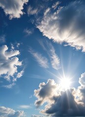 A wispy cirrus cloud against the brilliant blue of a summer sky with sunbeams peeking through , soft, feathery