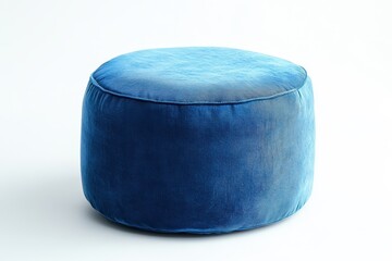 Circular blue pouf in a white room
