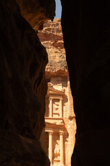 The iconic Al Khazneh in Petra, Jordan, showing intricate carvings and stunning architectural details. Travel, architecture, and archaeological themes. © Ann