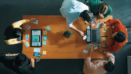 Programmer team brainstorm and plan Ux Ui design for mobile phone while present idea by using...