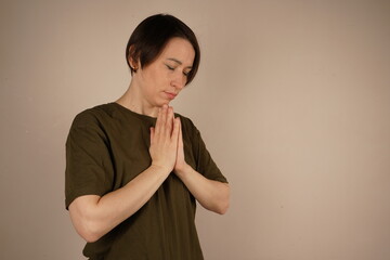 To put in hard work. Shot of a woman nervously wringing her hands. Close up.