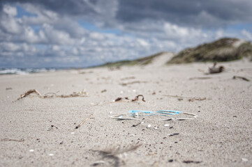 Wild sea lanscape polluted by a plastic garbage. Photoproject against pollution