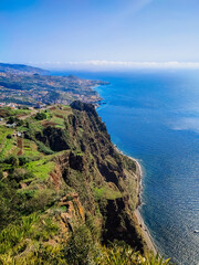 Top view, photograph of blue ocean landscape, land of European island with mountains, rocks.