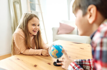 child girl boy education globe earth school map kid brother sister game playing classroom learning global geography travel science student continent planet exploration