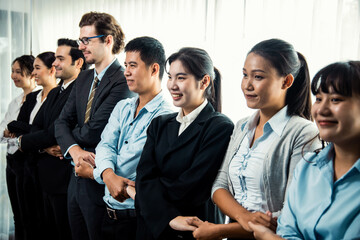 Modern diversity and multicultural company, business people joining hand together and standing in line, shared commitment to collaboration and cooperation concept background. Meticulous