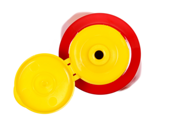 Red ketchup plastic bottle isolated on white, top view