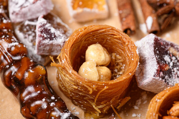Sweet food Turkish delight on wooden background, assorted locum and candy, decorated backdrop