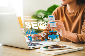 Businessman using computer to analyze SEO, search engine optimization, marketing, traffic ranking,...