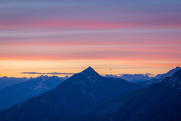 A sunset view of the mountain peaks taken from Mountain Seven on the outskirts of Golden in British Columbia