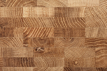 Oak wooden board as background, top view. Cross section of tree trunk. Natural durable end grain...