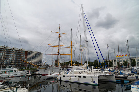 a beautiful harbor of the Belgian town Oostende or Ostend full of boats and sailing boats on an overcast August day by the North Sea (Ostend or Oostende, Belgium)	
