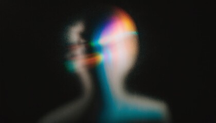 Iridescent blurred grainy silhouette on black background