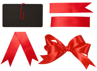 Red silk ribbon bow, black blank business card and ribbon on isolated background. Gift decor set
