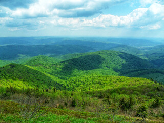 A breathtaking view of a green mountain range
