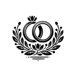 Elegant Black and White Wedding Rings with Floral Wreath: A Symbol of Love and Commitment