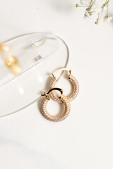 Close up of a gold earring